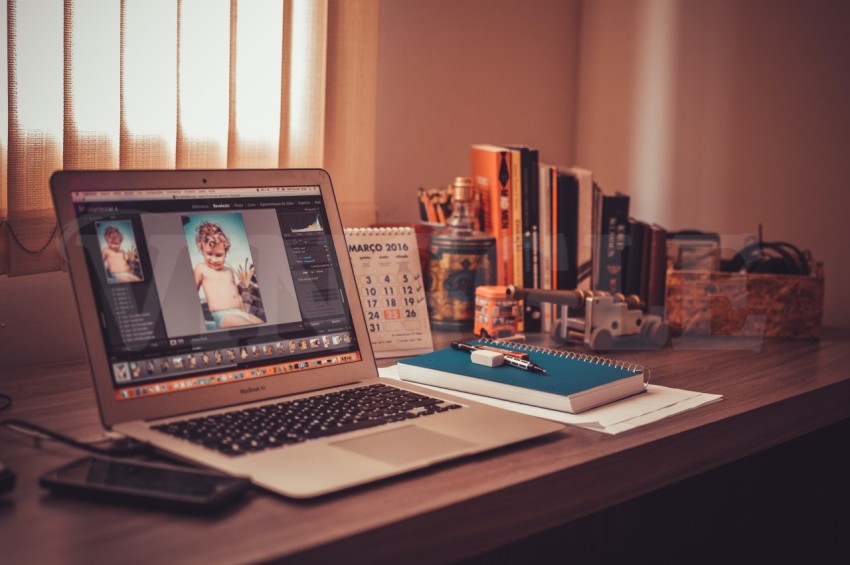 Screen Silver Macbook Air on Wooden Desk