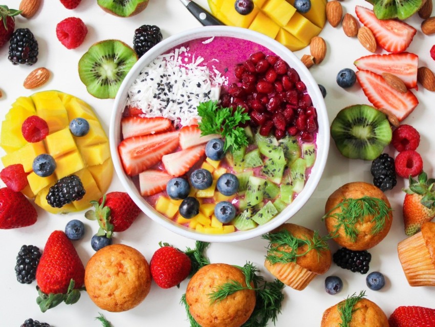 Assorted Sliced Fruits in White Ceramic Bowl